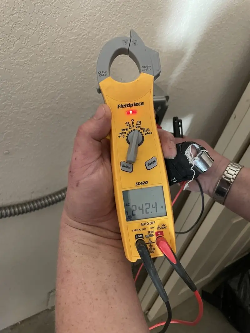 Voltage testing with clamp meter during Ceiling Fan Installation in La Crescent